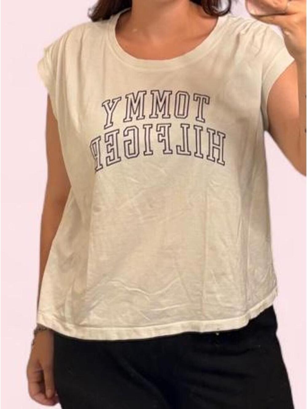 White Tommy Hilfiger baby tee with black text reading 'TOMMY HILFIGER'